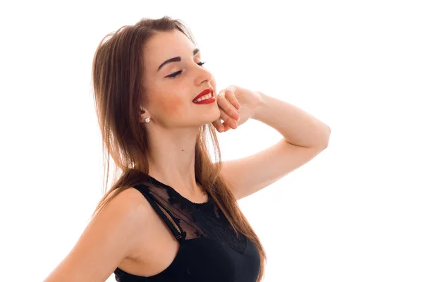 Sexy young brunette with red lips and closed eyes posing and smiling isolated on white background — Stock Photo, Image