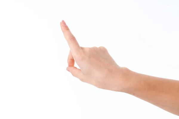 Mano femenina extendida hacia adelante con el dedo índice levantado se aísla sobre un fondo blanco — Foto de Stock