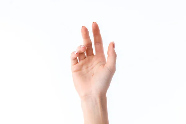 Mão feminina mostrando o gesto com as palmas das mãos para frente, isolada sobre fundo branco — Fotografia de Stock