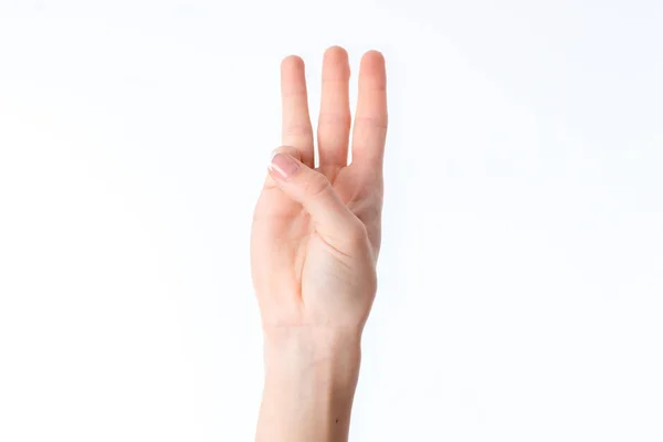 Mano femenina estirada y mostrando tres dedos aislados sobre fondo blanco — Foto de Stock