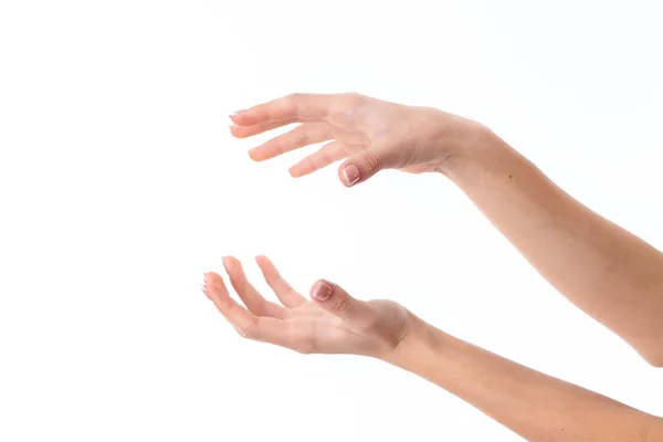 Két női kéz feltett egyik szemben a másik elszigetelt fehér background — Stock Fotó
