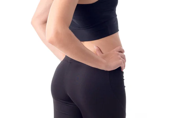 Parte del cuerpo una joven en pantalones deportivos negros primer plano — Foto de Stock