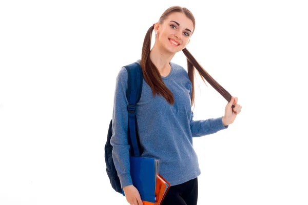Cheerful teen girl looks away and keeps hair hand — Stock Photo, Image