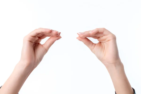 Las manos de las mujeres uno frente al otro con los dedos apretados aislados sobre fondo blanco — Foto de Stock