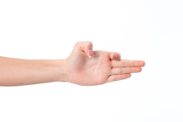 Female hand outstretched sideways with straight fingers and thumb  forefinger bent isolated on white background — Stock Photo, Image