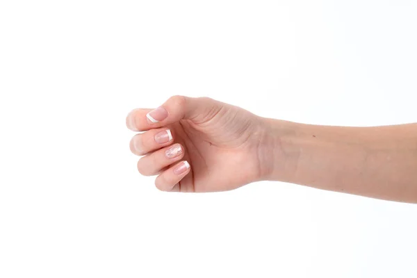 Weibliche Hand zur Seite gestreckt, Knie gebeugt, die Handfläche der Finger ist auf weißem Hintergrund isoliert — Stockfoto