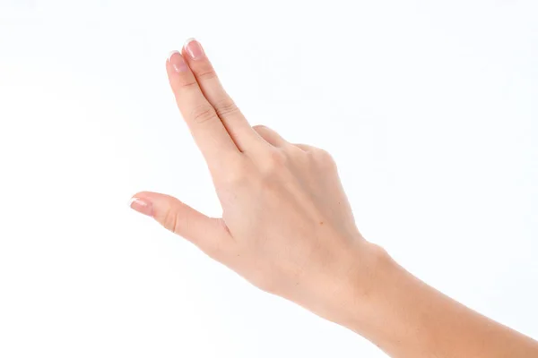 Женская рука показывает жест с тремя прямыми пальцами, изолированными на белом фоне — стоковое фото
