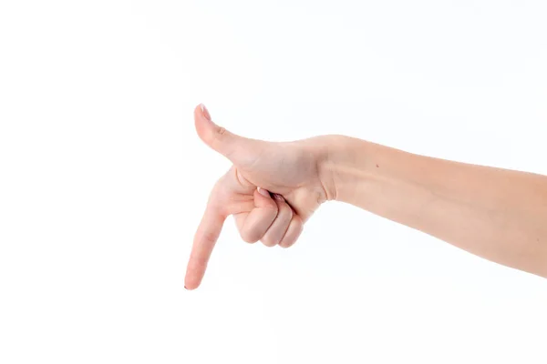 Mano de las mujeres con el dedo índice de las solapas bajadas aisladas sobre fondo blanco — Foto de Stock