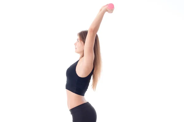 Fitness woman is caved in the back and holding the dumbbells — Stock Photo, Image