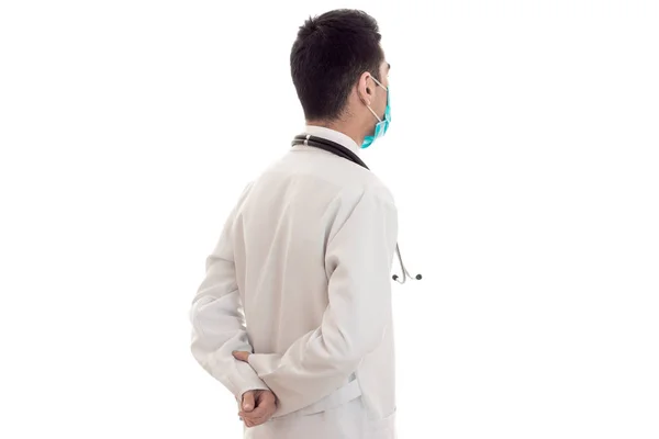 Jeune médecin en uniforme bleu avec stéthoscope sur le cou isolé sur fond blanc — Photo