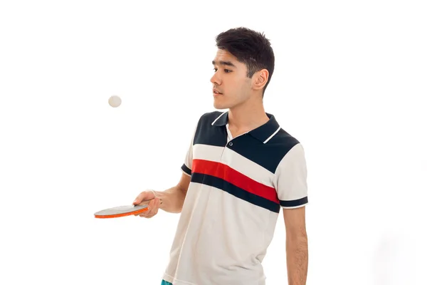 Portrait of handsome sportsman practicing table tennis in uniform isolated on white background — Stock Photo, Image