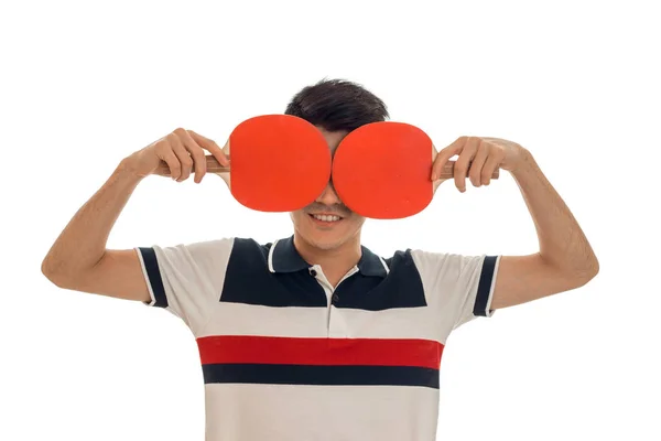 Divertido deportista morena con raquetas de tenis practicando ping pong aislado sobre fondo blanco — Foto de Stock