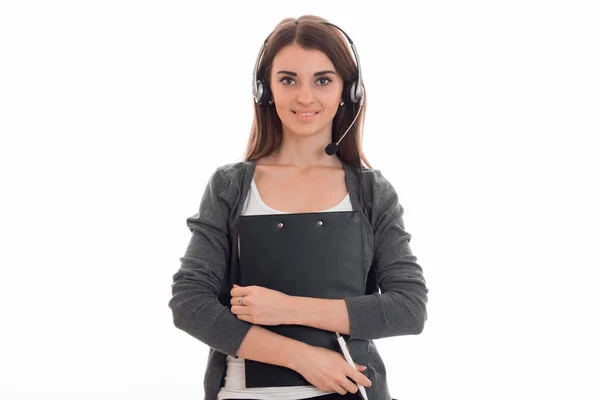 Smiling young girl in headphones and with the tablet in their hands looking at camera — Stock Photo, Image