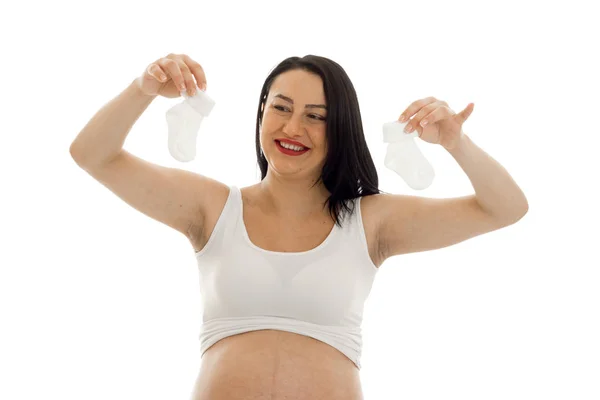 Young smiling pregnant woman in a white t-shirt, raised his hands and smiling — Stock Photo, Image