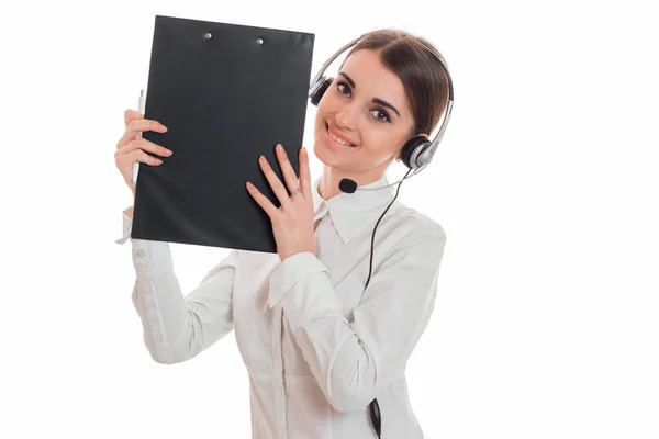 Beautiful young girl in a white shirt and smiles and lifts the Tablet — Stock Photo, Image