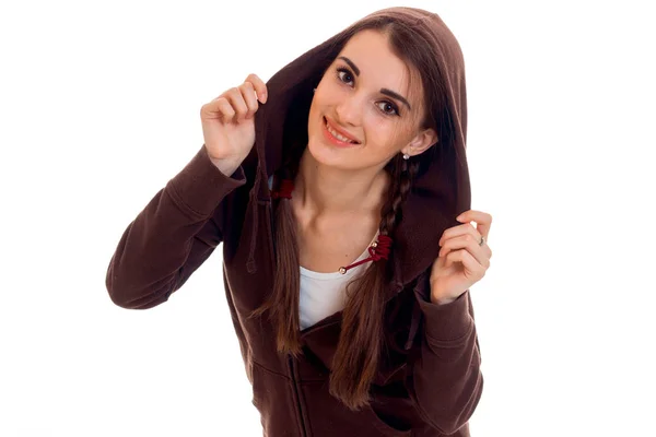 Cute teen girl with pigtails in the brown jacket looks into the camera and smiling — Stock Photo, Image