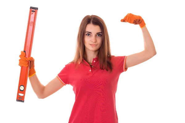 Молода дівчина тримає регулярні інструменти для ремонту квартири — стокове фото