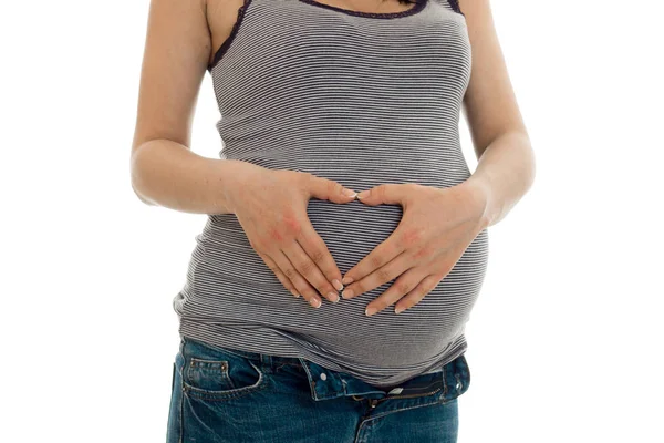 Beyaz arka plan üzerinde izole bir hamile kadın midsection
