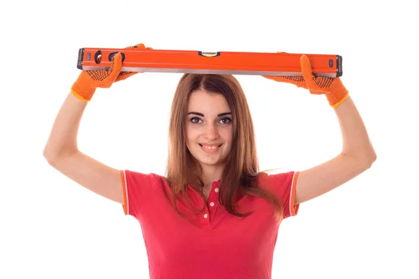 Belleza joven en uniforme hace renovación aislada sobre fondo blanco — Foto de Stock