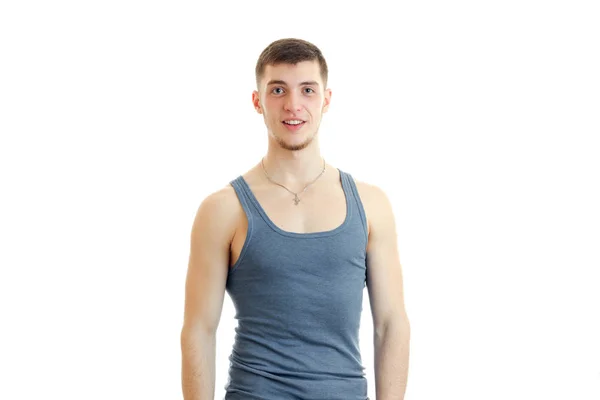 Young guy in the gray shirt posing on camera — Stock Photo, Image
