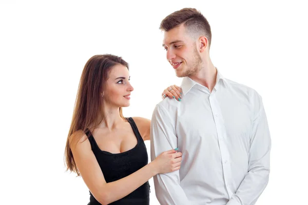 Young guy next to a beautiful girl look at each other — Stock Photo, Image