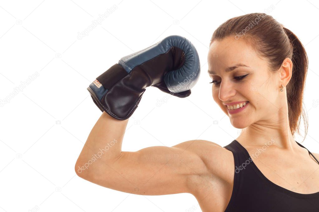 young smiling girl strained muscle on hand in Boxing Glove isolated on white background