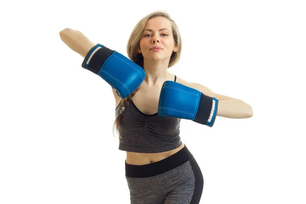 Cheerful young slim sports girl with boxing gloves — Stock Photo, Image