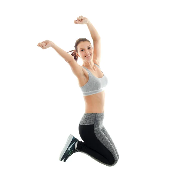 Fun athletic young girl at the top and she jumps up — Stock Photo, Image