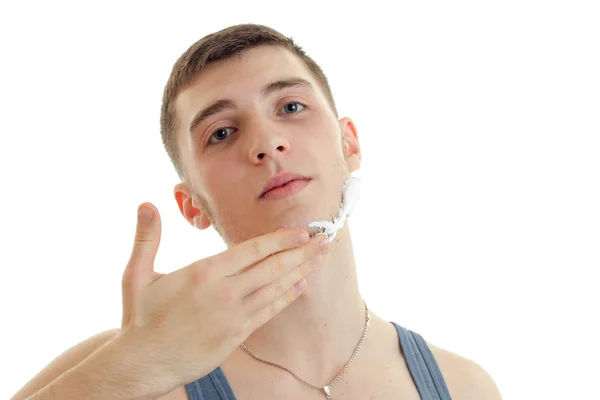 Young cute guy raised his head looks into the camera — Stock Photo, Image