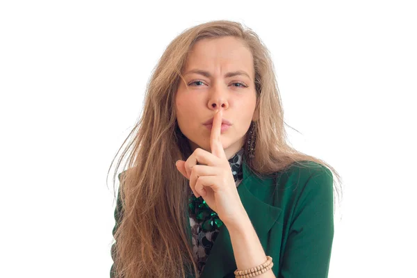 Beautiful young blonde keeps finger near the lips close-up — Stock Photo, Image