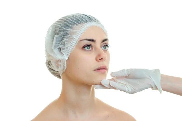 Portrait of a young girl without makeup in a special hat for examination by a doctor-cosmetologist close-up — Stock Photo, Image