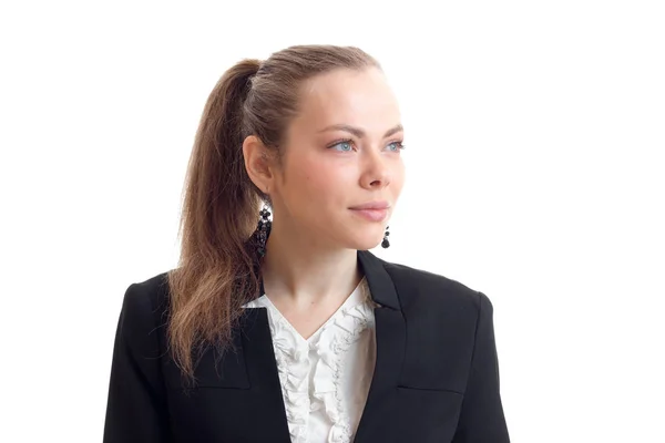 Portrait of chic young blonde with a ponytail and a jacket that looks toward close-up — Stock Photo, Image