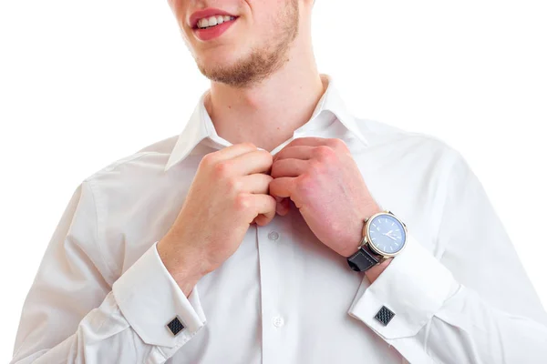 Portrait of a young guy who smiles and button hands shirt close-up — Stock Photo, Image