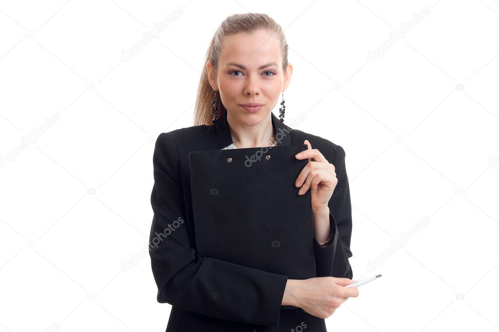 a charming young business woman looks straight and holding a black Tablet close-up