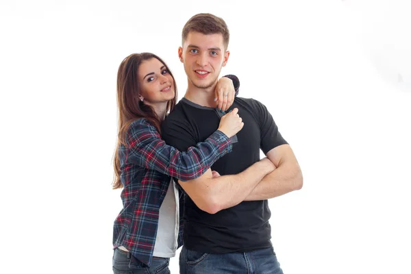 Pin-up girl in a Plaid Shirt hugging a young guy smiling — Stock Photo, Image