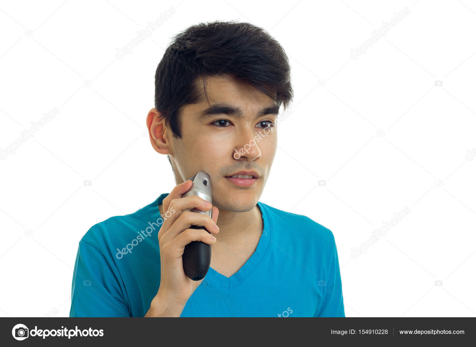 Portrait Of A Handsome Guy With Black Hair Who Shaves The Beard