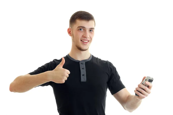 Vrolijke man met trimmer in de ene hand tonen duimen omhoog met een ander — Stockfoto