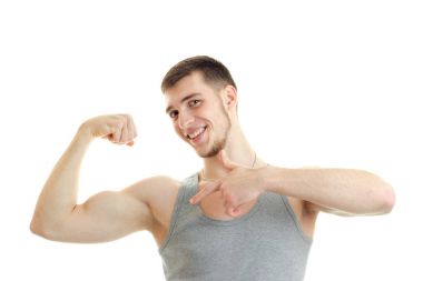 Komik Spor muhabiri onun kas el yakın çekim gösterir.