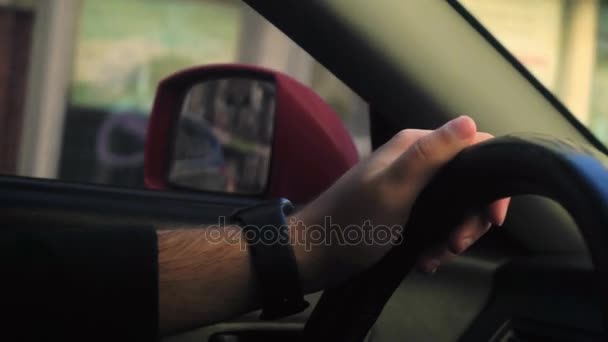 Young man behind a wheel drive — Stock Video