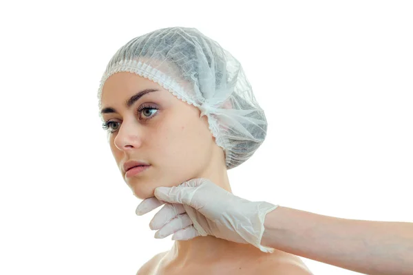 Horizontal portrait of a young girl in the medical CAP which turned her head aside in a cabinet with a doctor — Stock Photo, Image