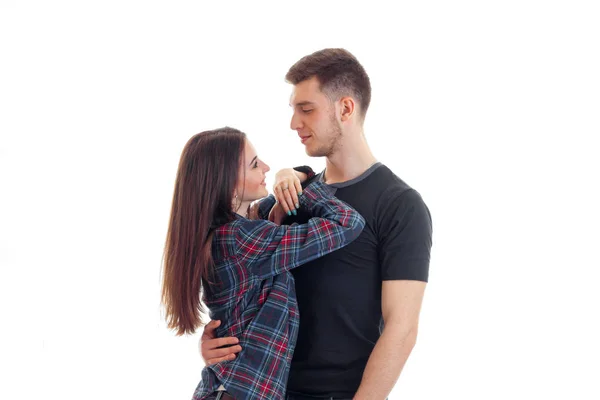 Amazing young girl with long hair gently hugs her boyfriend — Stock Photo, Image