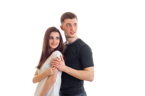 Couple hugging and looking to the side — Stock Photo, Image