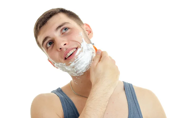 Close-up portrait of a young guy with a funny beard foam — Stock Photo, Image