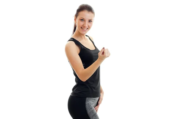 Alegre mujer deportiva en uniforme deportivo sonriendo en la cámara — Foto de Stock