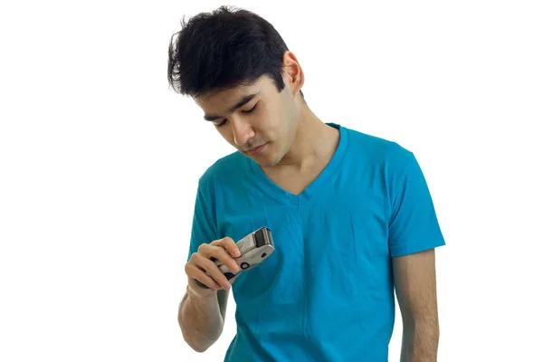 Young caucasian man shaving with trimmer — Stock Photo, Image