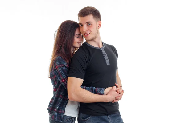 Cheerful young girl hugs her boyfriend — Stock Photo, Image