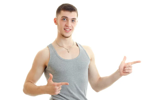 Hilarious charming guy shows his hands and smiling — Stock Photo, Image