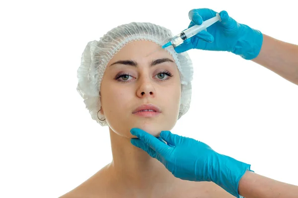 Cosmetologist in gloves makes procedures on the face of a young girl have close-up — Stock Photo, Image