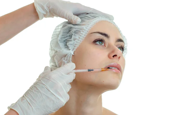 Close-up portrait of a young girl with a clean skin in a special cap for hair in the Office of a doctor — Stock Photo, Image