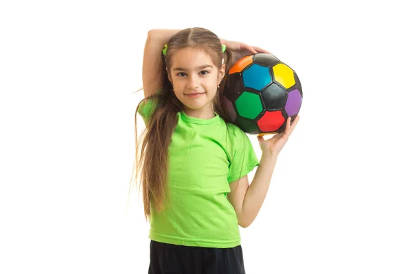 Cutie bambina con pallone da calcio multicolore in mano — Foto Stock